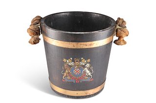 A BRASS-BOUND COOPERED OAK FIRE BUCKET, with leather-bound rope handle, pai