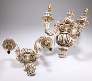A PAIR OF BAROQUE STYLE SILVERED WOOD TWO-LIGHT WALL SCONCES, the scrolling