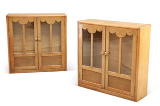 A PAIR OF ART DECO OAK BOOKCASES, each with a pair of glazed and panelled d