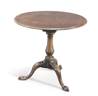 A GEORGE III MAHOGANY TILT-TOP TRIPOD TABLE, the moulded circular plum pudd