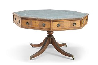 A LEATHER-INSET MAHOGANY OCTAGONAL LIBRARY TABLE, LATE 19TH CENTURY, the top segmented leather writing surface above a frieze fitted with four drawers