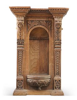 A VICTORIAN CARVED OAK VASE STAND, with acorn leaves and grotesque masks. 7