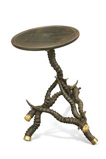 A BLACKBUCK HORN TABLE, CIRCA 1900, the dished circular top raised on a tri