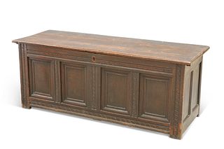A LATE 17TH CENTURY OAK COFFER, with carved rails and four-panel front. 57c