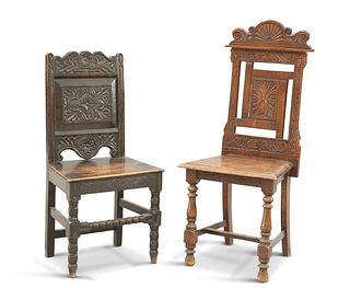 TWO VICTORIAN CARVED OAK HALL CHAIRS, each with panel back and boarded seat