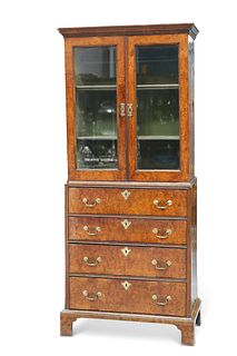 AN EARLY 18TH CENTURY WALNUT CABINET ON CHEST, the upper section with mould