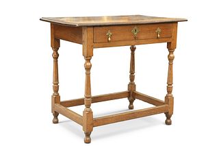 AN 18TH CENTURY OAK SIDE TABLE, the moulded rectangular top above a long dr