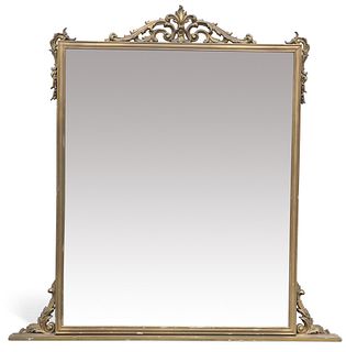 A PERIOD STYLE GILT OVERMANTEL MIRROR, with pierced scrolling leaf-form cre