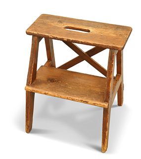 A 19TH CENTURY COUNTRY PINE STOOL, the two tiers raised on splayed supports