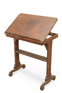 A 19TH CENTURY OAK ADJUSTABLE READING STAND, the moulded rectangular top wi