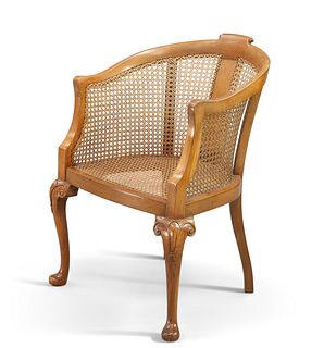AN EARLY 20TH CENTURY BERGÈRE TUB CHAIR, with cabriole legs and pad feet. H