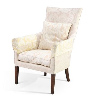 A GEORGE III MAHOGANY AND UPHOLSTERED ARMCHAIR, raised on reeded square-sec