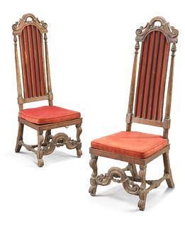 A PAIR OF CONTINENTAL 17TH CENTURY WALNUT HIGH-BACK CHAIRS, each with scrol