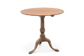 A GEORGE III STYLE MAHOGANY TILT-TOP TRIPOD TABLE, with piecrust top and hi