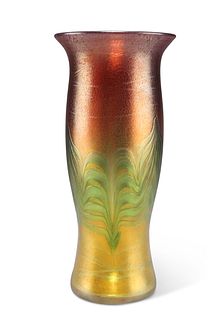 AN IRIDESCENT STUDIO GLASS VASE, of baluster form with out-turned rim, sign