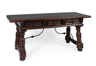 Refectory table. Spain, XVII century. 
Carved walnut wood and iron fasteners.