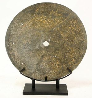 LARGE BLACK MILLSTONE ON STAND