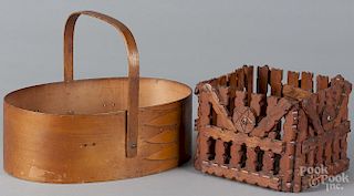 Shaker swing-handled sewing basket, 19th c., 3 7/8'' h., 10 3/4'' w., together with a tramp art basket