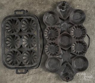 Two cast iron muffin pans, late 19th c., 13 1/4'' l. and 16 3/4'' l.