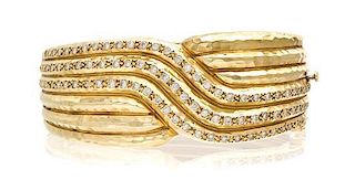 * A 14 Karat Yellow Gold and Diamond Bracelet, 47.40 dwts.