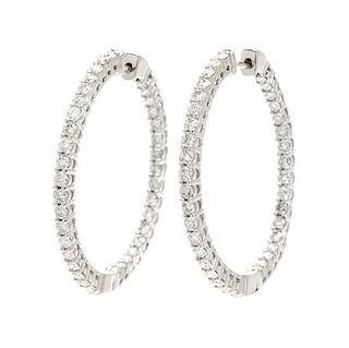 * A Pair Of 14 Karat White Gold and Diamond Hoop Earrings, 4.20 dwts.