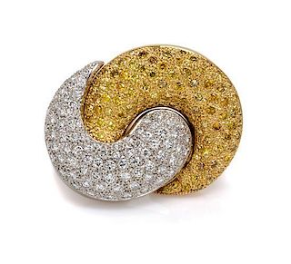 * An 18 Karat Two Tone Gold, Colored Diamond and Diamond Brooch, 24.80 dwts.