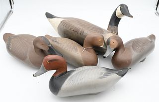 Five Madison Mitchell Carved Decoys
to include a drake, three hens, along with a Canadian goose
goose length 20 1/2 inches