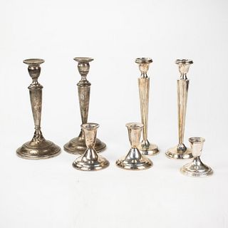 Grouping of Seven Weighted Sterling Candlesticks