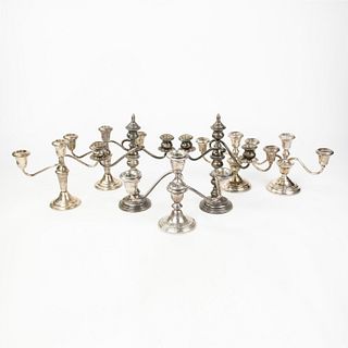 Grouping of 7 Weighted Sterling Candlesticks