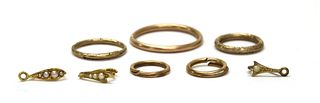 Four gold split rings,