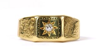 An 18ct gold star set diamond ring,