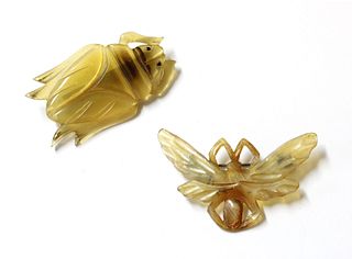 Two French Art Nouveau carved horn brooches,