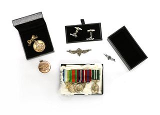 A 9ct gold circular Royal Naval Air Service (RNAS) locket,