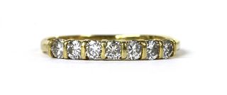 An 18ct gold diamond half eternity ring,