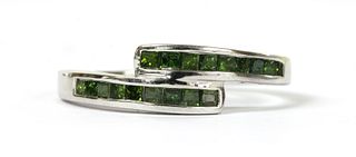 A 9ct white gold treated green diamond crossover ring,