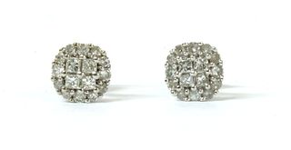A pair of white gold diamond cluster earrings,