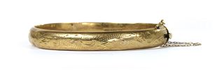 A 9ct gold hollow oval bangle,