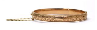 A 9ct gold hollow oval hinged bangle,