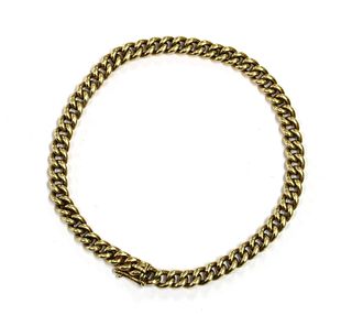 A gold curb link bracelet,