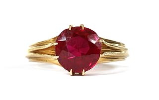 A gold single stone synthetic ruby ring,