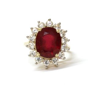 A 9ct gold fracture filled ruby and zircon cluster ring,