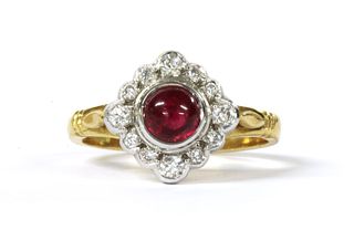 An 18ct gold ruby and diamond off set square cluster ring,