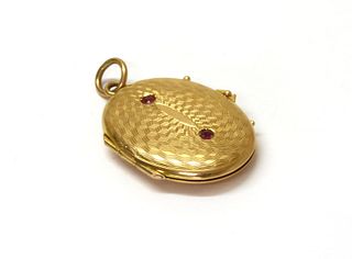 A gold ruby set locket,