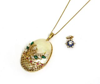 A gold mother-of-pearl and paste set pendant,