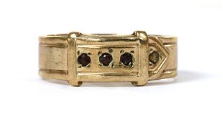 A 9ct gold garnet set buckle ring,