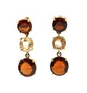 A pair of gold three stone garnet drop earrings,