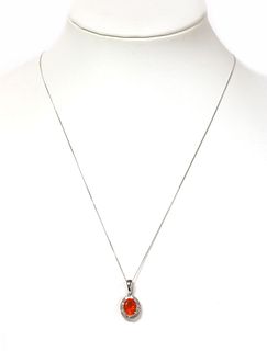 A white gold fire opal and diamond cluster pendant,