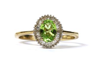 A gold peridot and diamond cluster ring,