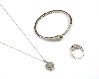 A silver chrome diopside and diamond set panther bangle, pendant and ring suite,