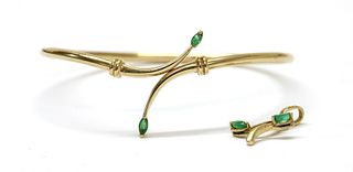 A gold emerald bangle,